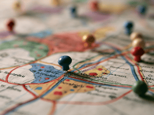 map marked with several colorful pushpins